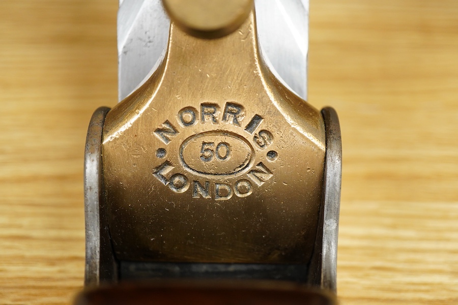 A Norris No.50 adjustable smoothing plane, stamped with Norris, London to both the brass lever cap and the iron, with owner’s name stamped to the handle